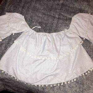 New never worn size large off the shoulder Pom Pom top